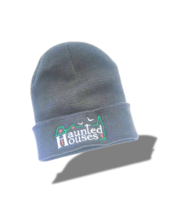 a grey beanie with a haunted houses logo on it